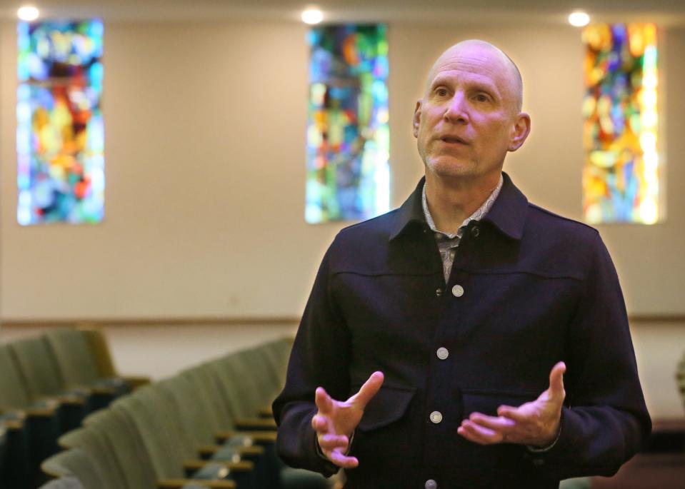 Bobby Selvaggio, executive director of Creative Arts Collaborative Center, talks about some of the planned art events that can be held at Highland Square Universal Gathering Place, HUG art center, in the former Temple Israel on Thursday.