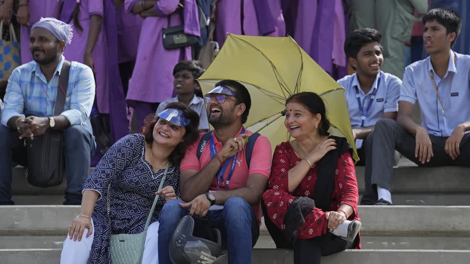 People listen to a live broadcast of scientists speaking after the launch of spacecraft Chandrayaan-3. - Aijaz Rahi/AP
