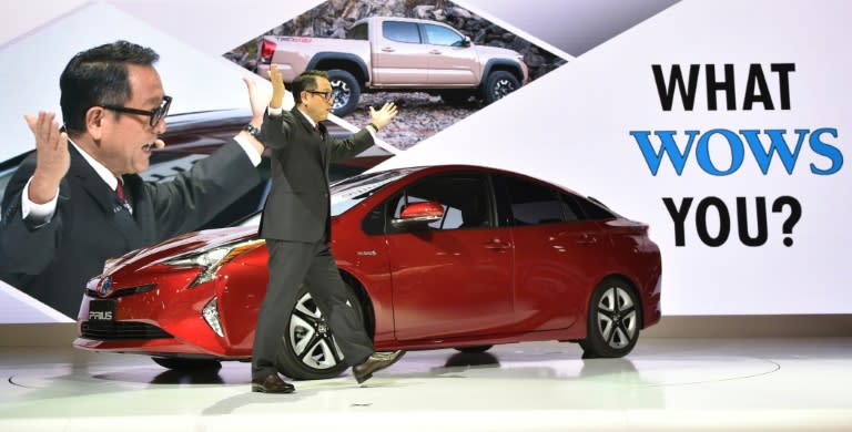 Toyota Motor president Akio Toyoda delivers a speech in front of the company's next generation hybrid vehicle Prius during the Tokyo Motor Show, on October 28, 2015