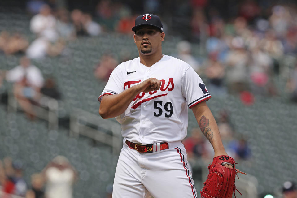 Minnesota Twins relief pitcher Jhoan Duran (59) reacts after winning 7-1 against the San Francisco Giants following a baseball game, Wednesday, May 24, 2023, in Minneapolis. (AP Photo/Stacy Bengs)