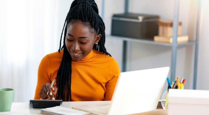 Woman buys stocks using a DRiP approach