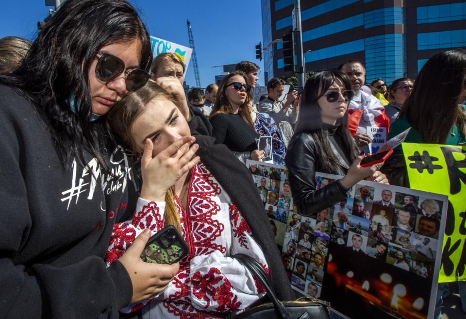 Protesters lean on each other in Westwood.