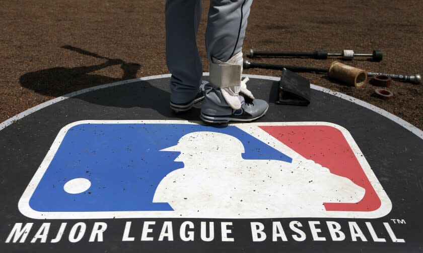 FILE - In this April 24, 2013, file photo, Cleveland Indians second baseman Jason Kipnis stands on the Major League Baseball logo that serves as the on deck circle during the first inning of a baseball game between the Chicago White Sox and the Indians, in Chicago. Major League Baseball rejected the players' offer for a 114-game regular season in the pandemic-delayed season with no additional salary cuts and told the union it did not plan to make a counterproposal, a person familiar with the negotiations told The Associated Press. The person spoke on condition of anonymity Wednesday, June 3, 2020, because no statements were authorized.(AP Photo/Charles Rex Arbogast, File)