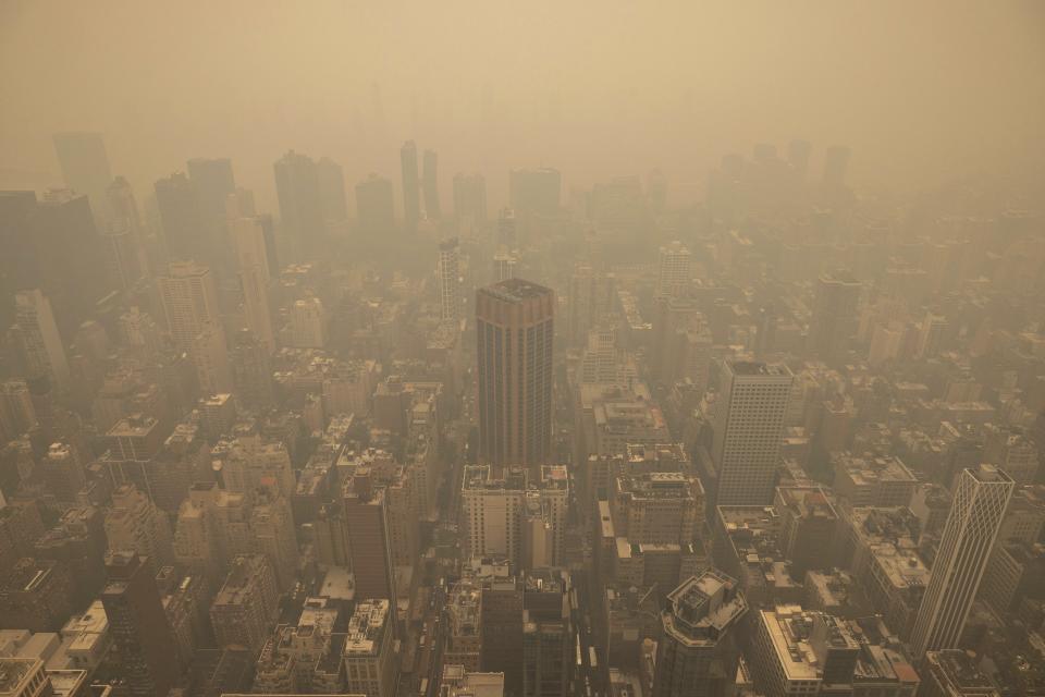 FILE - Haze is visible in New York City from the Empire State Building observatory, June 7, 2023, in New York. As smoky as the summer has been so far, scientists say it will likely be worse in future years because of climate change. (AP Photo/Yuki Iwamura, File)
