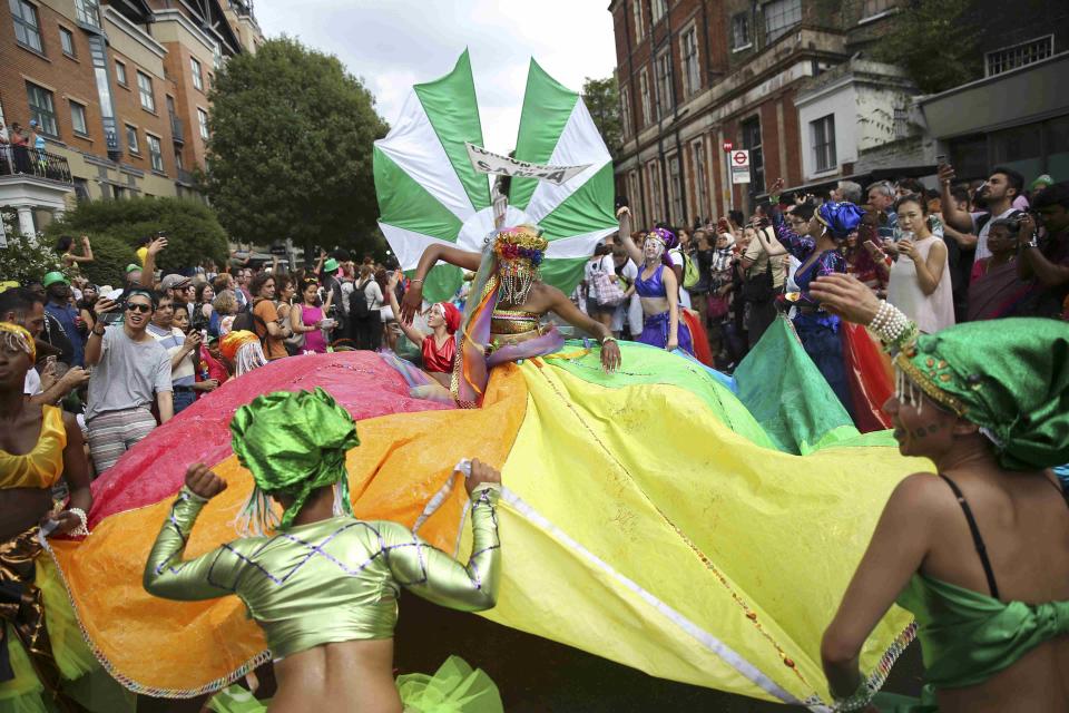 <em>Carnival – revellers at the Notting Hill Carnival can expect sunny conditions, forecasters predict (Pictures: Reuters)</em>