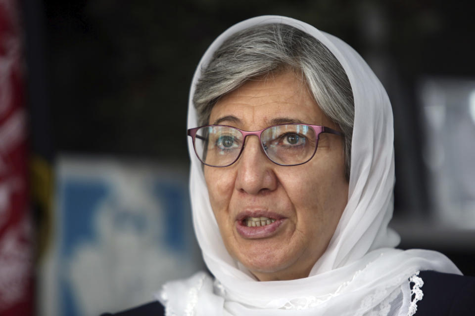 FILE - In this April 7, 2018, file photo, Dr. Sima Samar, chairperson of Afghanistan's Independent Human Rights Commission, speaks during an interview with The Associated Press in Kabul, Afghanistan. Afghan rights workers, including Sama, are warning that U.S. National Security Adviser John Bolton's blistering attack on the International Criminal Court investigating war crimes allegations will strengthen a climate of impunity in Afghanistan, prolong the war and embolden those carrying out acts of violence. In a speech Monday, Bolton said Washington would not cooperate with The Hague-based court and threatened it with sanctions, saying it put U.S. sovereignty and national security at risk. (AP Photo/Rahmat Gul, File)