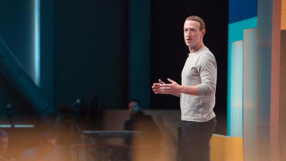 Mark Zuckerberg on stage during the company's keynote presentation.  Profile view from left side.