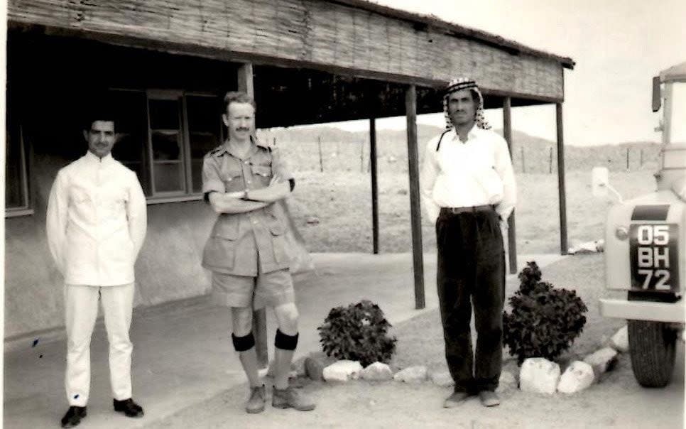 Colin Bligh, centre, in Aqaba, Jordan, with Ahmed, left, his batman, and Rizza, his driver