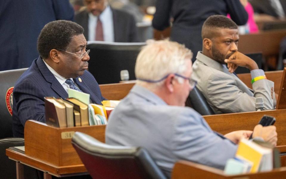 North Carolina state Reps. Garland Pierce, left, and Cecil Brockman, right, listen to debate as lawmakers prepare to hold the first of several votes on the budget at the General Assembly in Raleigh, N.C. on Sept. 21, 2023.