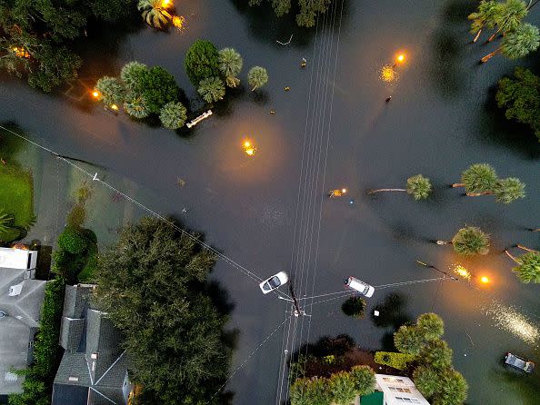 In this aerial view, cars sit in floodwater near downtown after Hurricane Ian on September 29, 2022, in Orlando, Florida.