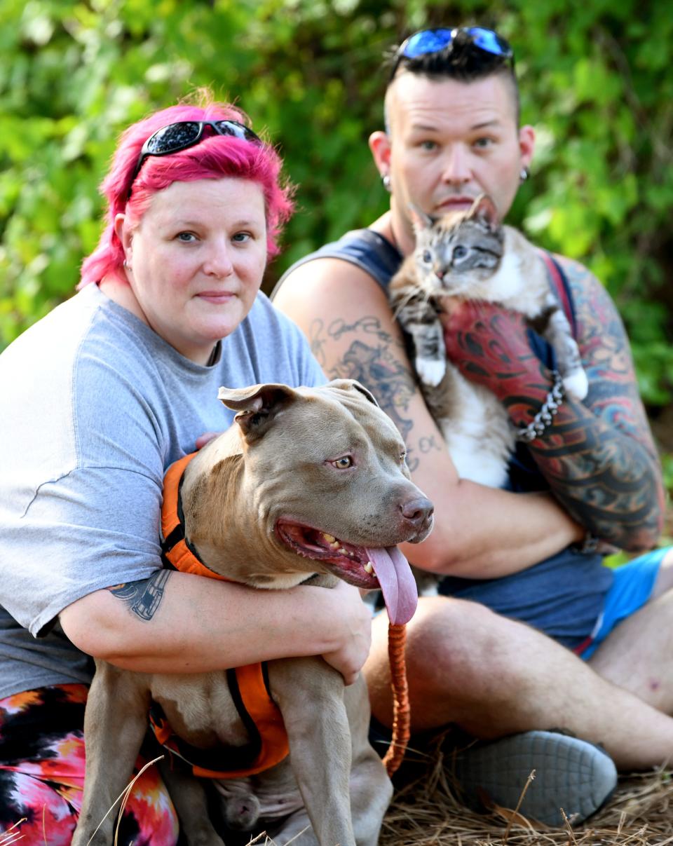 Robyn and Robert Feaganes of CH Lives Matter Rescue Inc., Palm Bay, with two of the several animals they have adopted with cerebellar hypoplasia, a brain condition that can lead to a loss in coordination and balance. Tank the Trainwreck is a humorous and sweet- natured red nose pitbull, and Billy Bobble Thornton is a cuddly cat who patiently poses for photos. For more info on their animal rescue, visit www.chlivesmatterrescue.com.