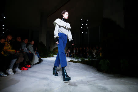 A model presents a creation during the ALEXACHUNG catwalk show by designer Alexa Chung during London Fashion Week Women's A/W19 in London, Britain February 16, 2019. REUTERS/Henry Nicholls