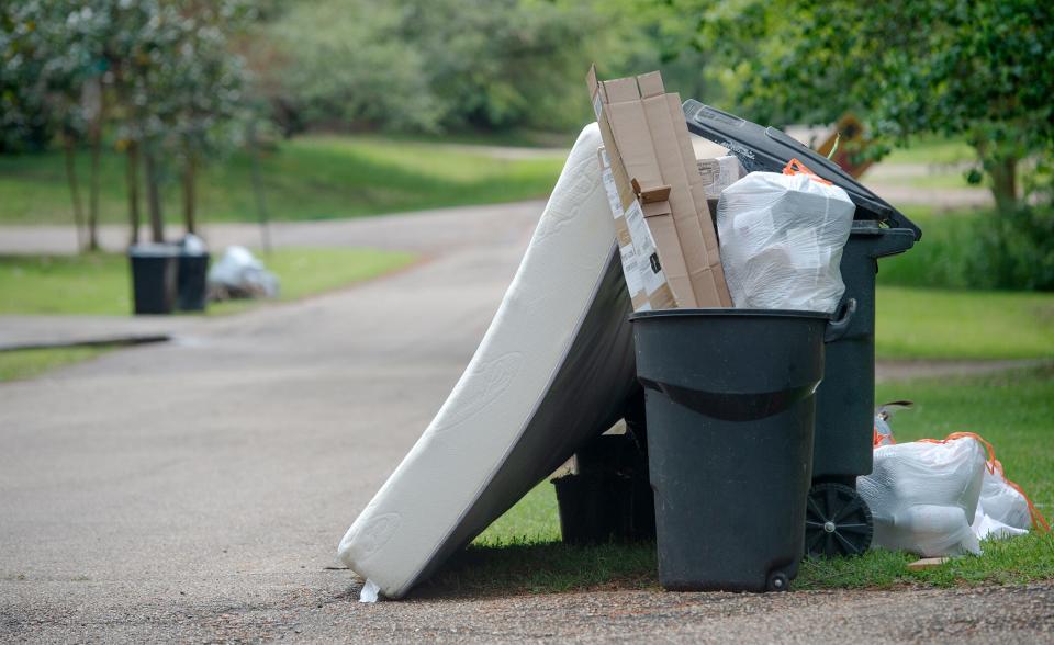 Optimistic Jackson, Miss., residents put out their trash in hopes of it being picked up Monday, April 3, 2023, although the mayor and city council have not come to an agreement on what company to award the contract for trash pickup.