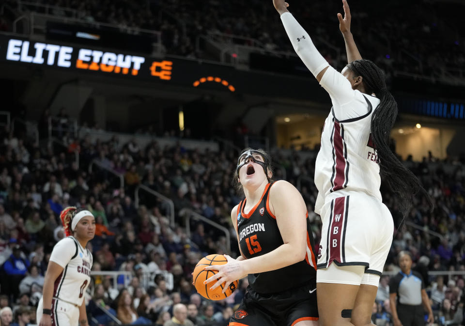 Oregon State forward Raegan Beers (15) looks to shoot against South Carolina center Kamilla Cardoso (10) during the third quarter of an Elite Eight round college basketball game during the NCAA Tournament, Sunday, March 31, 2024, in Albany, N.Y. (AP Photo/Mary Altaffer)