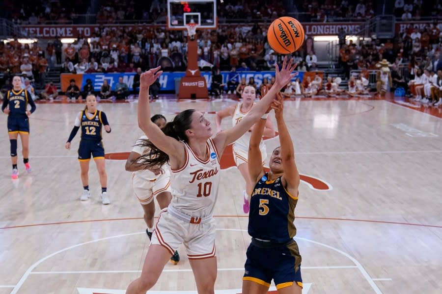 Texas guard Shay Holle (10) grabs a rebound over Drexel forward Chloe Hodges (5) during the second half of a first-round college basketball game in the women’s NCAA Tournament in Austin, Texas, Friday, March 22, 2024. (AP Photo/Eric Gay)