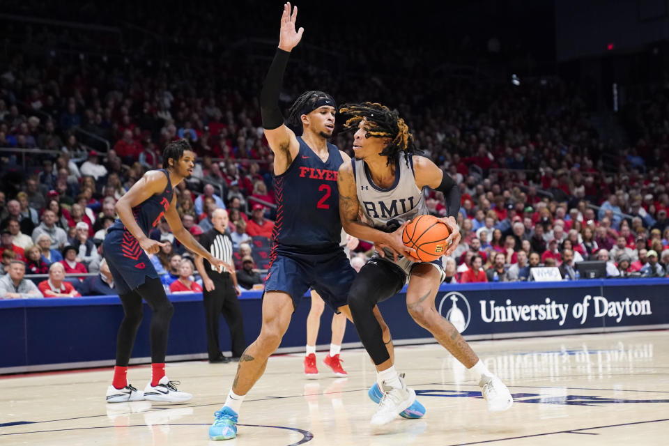 Dayton forward Toumani Camara (2) defends as Robert Morris forward Kahliel Spear moves to the basket during the second half of an NCAA college basketball game, Saturday, Nov. 19, 2022, in Dayton, Ohio. (AP Photo/Joshua A. Bickel)