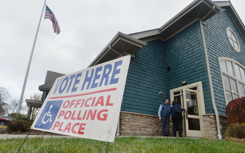Voters enter and exit the Lincoln Community Center, Erie County Public Library, in Fairview Township on election day on Tuesday.