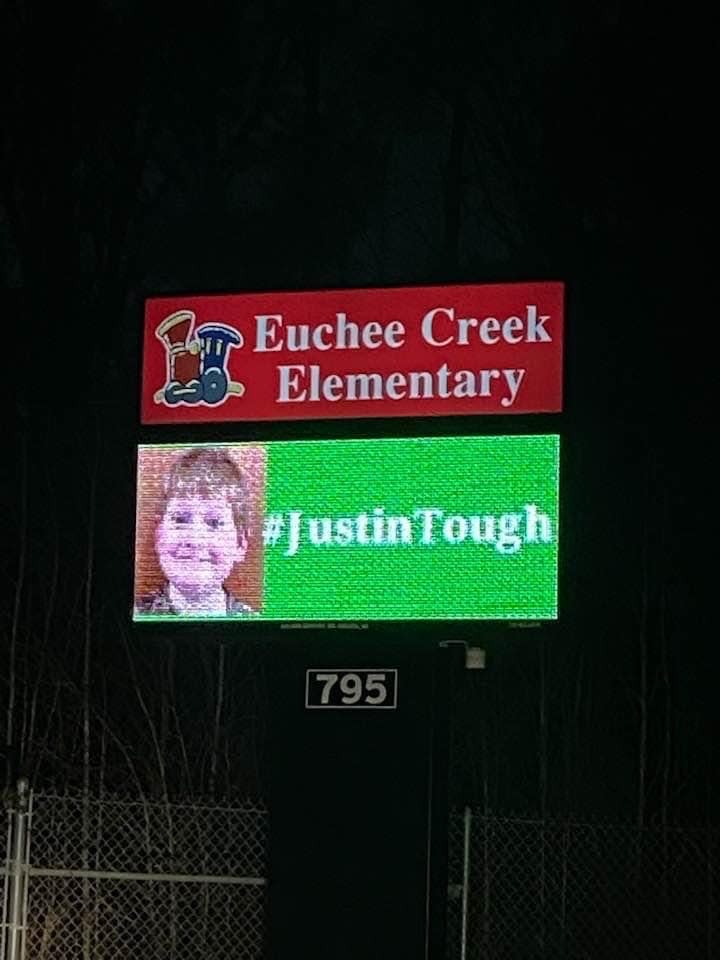Euchee Creek Elementary shares the #JustinTough hashtag in support of the recovering 11-year-old.