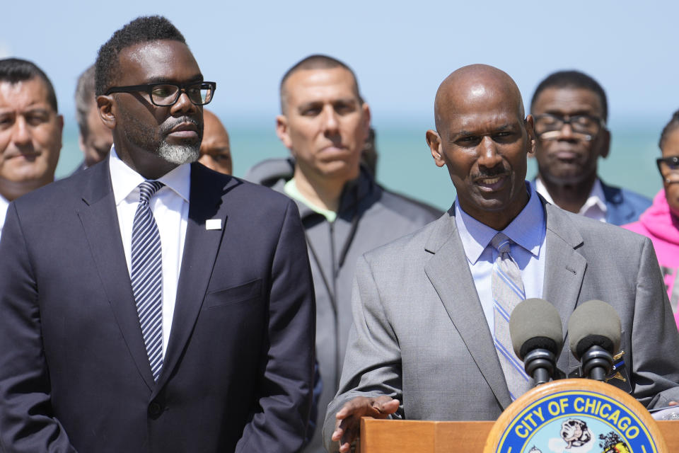 Chicago Mayor Brandon Johnson, left, listens to Interim Police Superintendent Fred Waller, as they outline the city's public safety plan in advance of Memorial Day weekend Thursday, May 25, 2023, in Chicago. Chicago is heading into the Memorial Day weekend hoping to head off violence that tends to surge with rising temperatures of summer. Even the state of Illinois is assisting by sending in what it's called "peacekeepers" in an attempt to deescalate violent situations. (AP Photo/Charles Rex Arbogast)