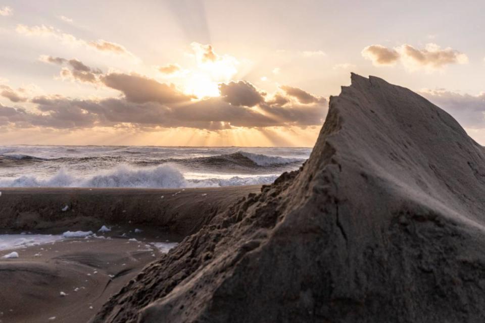 The sun rises in Rodanthe Friday, Sept, 15, 2023 as Hurricane Lee churns in the Atlantic hundreds of miles offshore.