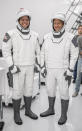 This July 31, 2019 photo made available by SpaceX shows astronauts Bob Behnken, left, and Doug Hurley in Hawthorne, Calif., during a joint training event between NASA and SpaceX. Following crew suit-up, the crew ingressed the capsule simulator in Hawthorne, Calif., as they would on launch day, and the teams performed a simulated launch countdown and several emergency egress scenarios. SpaceX designed and built its own suits, which are custom-fit. (SpaceX via AP)