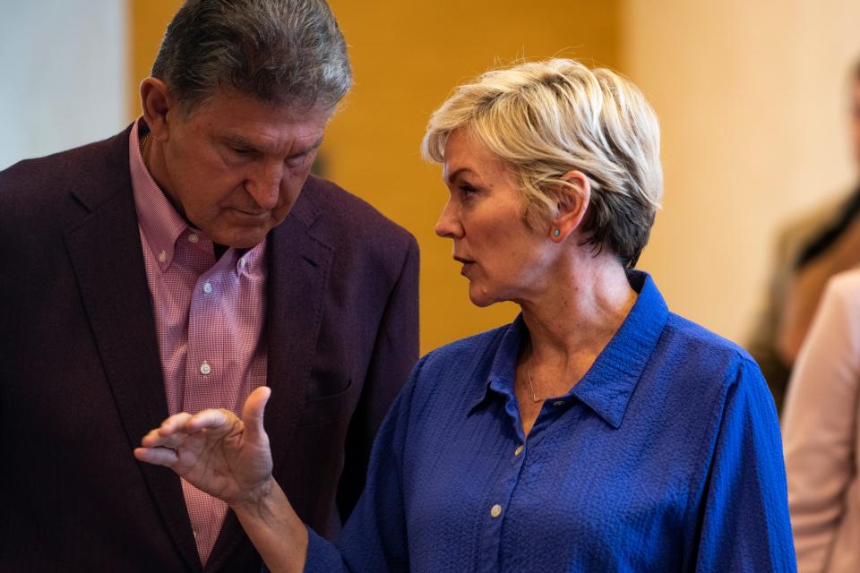 Sen. Joe Manchin and Energy Secretary Jennifer Granholm arrive at a news conference on June 3, 2021, in Morgantown, W.Va.