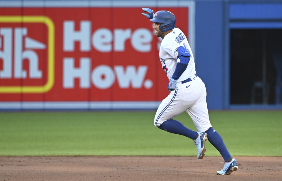 Toronto Blue Jays' George Springer rounds the bases after hitting a solo home run against the Cleveland Indians during the first inning of a baseball game Wednesday, Aug. 4, 2021, in Toronto. (Jon Blacker/The Canadian Press via AP)