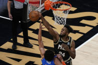 Atlanta Hawks forward Bruno Fernando (24) rejects Oklahoma City Thunder center Isaiah Roby (22) attempt to score during the second half of an NBA basketball game on Thursday, March 18, 2021, in Atlanta. (AP Photo/Brynn Anderson)