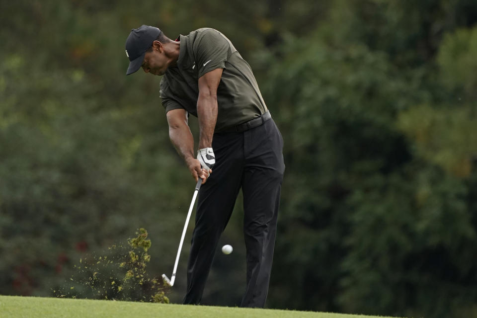 Tiger Woods hits on the 15th fairway during the first round of the Masters golf tournament Thursday, Nov. 12, 2020, in Augusta, Ga. (AP Photo/Charlie Riedel)