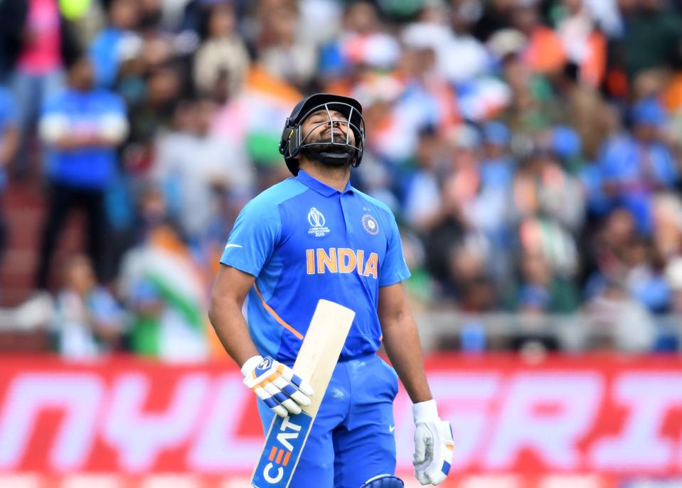 Sharma furious with himself on his way back to pavilion after falling for 140 (Photo by DIBYANGSHU SARKAR/AFP/Getty Images)