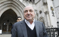 FILE - Self-exiled oligarch Boris Berezovsky leaves the High Court in London, Wednesday, March, 10, 2010, after winning his libel case against a Russian broadcaster that accused him of masterminding the murder of a former Russian agent in London. After President Vladimir Putin came to power in 2000, he was reported to have told about two dozen of the men regarded as Russia's top oligarchs that if they stayed out of politics, their wealth wouldn't be touched. Berezovsky, a Putin critic, was granted asylum in the United Kingdom in 2003. Ten years later, he was found dead in his home; a disputed post-mortem examination said he appeared to have hanged himself. (AP Photo/Alastair Grant, File)