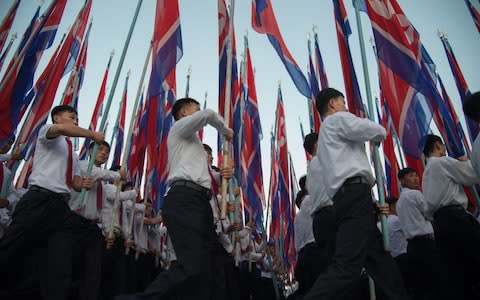 Students march during a mass rally on Kim Il-Sung sqaure in Pyongyang on September 23, 2017 - Credit: KIM WON-JIN/ AFP