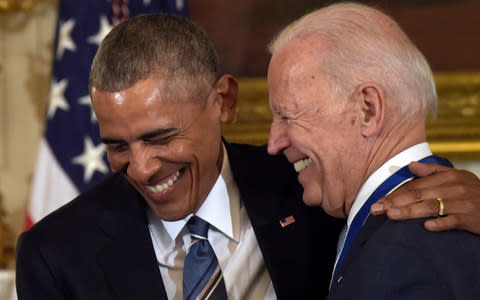President Barack Obama shares a laugh with Vice President Joe Biden during a ceremony in the State Dining Room of the White House in Washington - Credit: AP Photo/Susan Walsh