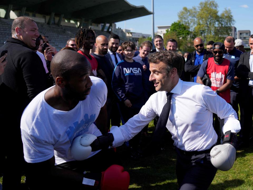 Macron spars with amateur boxer Jean-Denis Nzaramba, 23, at the Auguste Delaune stadium in Saint Denis (POOL/AFP/Getty)