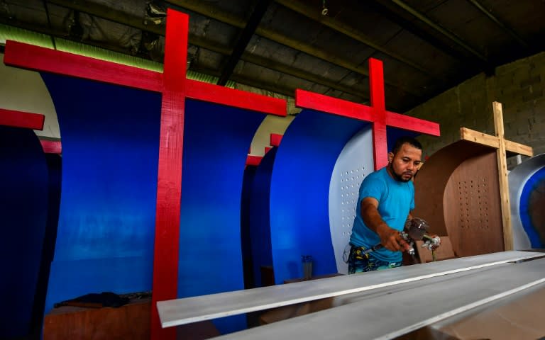 Around 30 inmates are busy making confession boxes that will be used by pilgrims to confess their sins to priests during the pope's January 22-27, 2019 visit to mark the Catholic World Youth Day festival