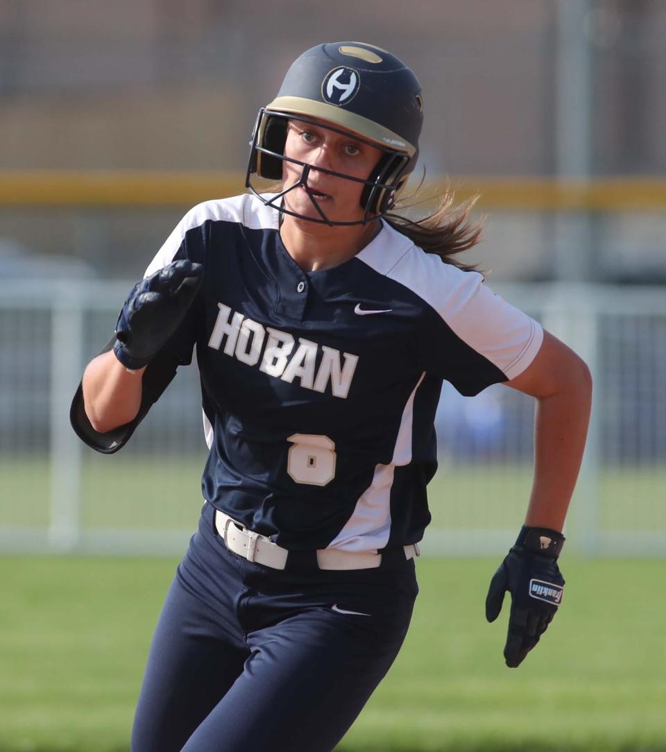 Ellie Hardman of Hoban runs for a triple their Division II district final game against Tallmadge at Willig Park in Canton on Thursday. Hoban won 11-0. 