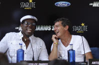 Cast members Wesley Snipes (L) and Antonio Banderas smile as they attend a news conference to promote the film "The Expendables 3" during the Starlite Festival in Marbella, near Malaga, southern Spain, August 5, 2014. REUTERS/Jon Nazca (SPAIN - Tags: ENTERTAINMENT)