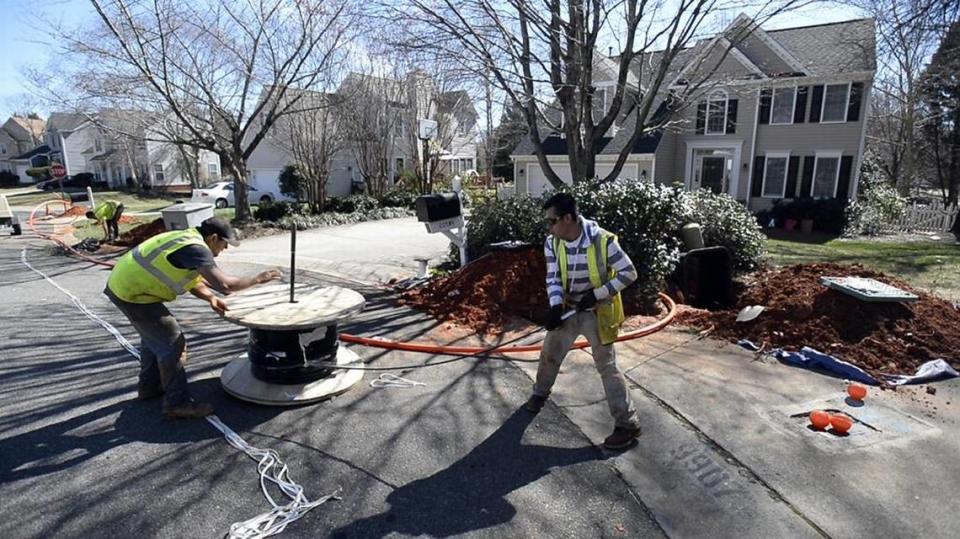 In this Charlotte Observer file photo, workers install fiber optic cable lines for AT&T Fiber in the Davis Lake neighborhood. New AT&T Fiber service will expand into Rock Hill.
