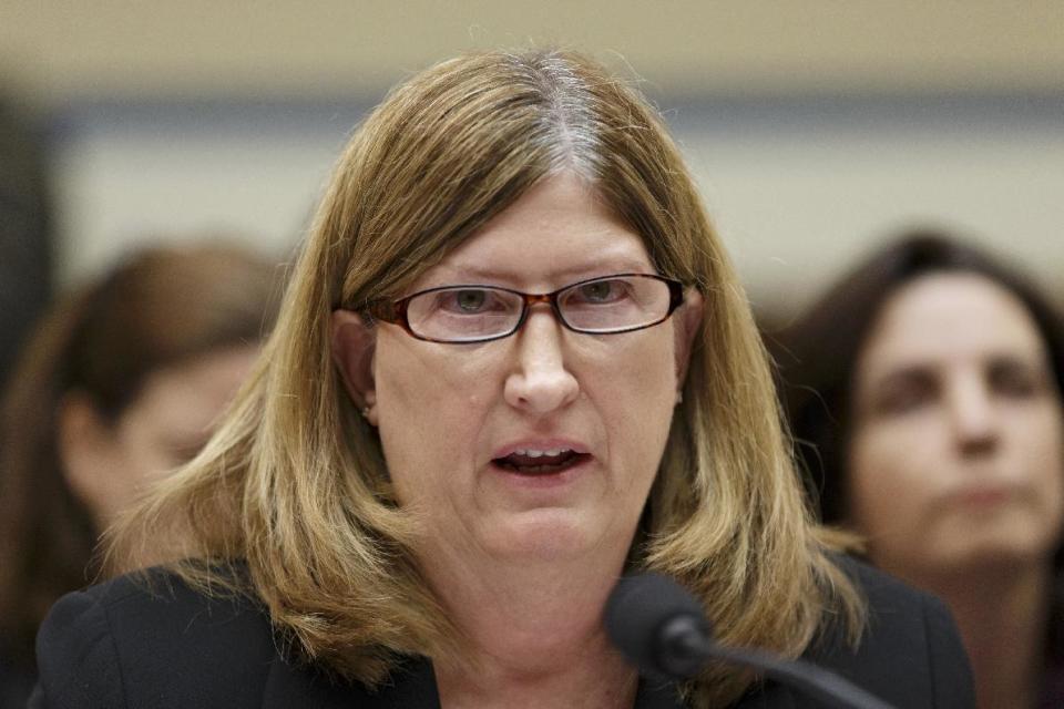 FILE - In this Jan. 16, 2014 file photo, Teresa Fryer, Medicare's top cybersecurity official, testifies on Capitol Hill in Washington. As the Obama administration raced to meet its self-imposed deadline for online health insurance markets, security experts working for the government worried that state computer systems could become a back door for hackers. In one email from Sept. 29, a Sunday two days before the launch, Fryer, chief information security officer for the federal Centers for Medicare and Medicaid Services, wrote of the state security approvals, “The front office is signing them whether or not they are a high risk.” Her agency, known as CMS, is in charge of administering the health care law. (AP Photo/J. Scott Applewhite, File)