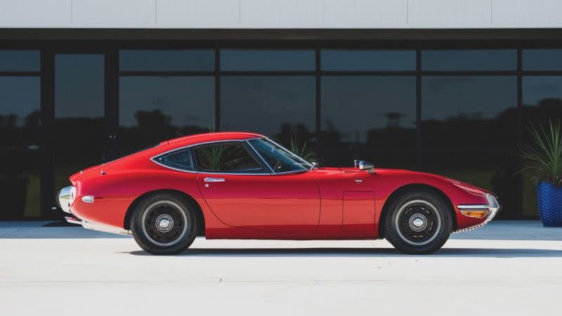 <img src="1967-toyota-2000gt.jpg" alt="Profile view of a 1967 Toyota 2000GT heading to auction">