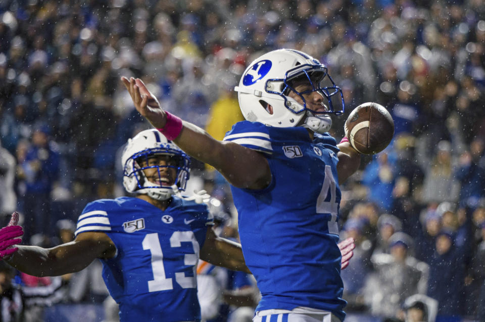 BYU running back Lopini Katoa (4) celebrates a touchdown during the first half of the team's NCAA college football game against Boise State on Saturday, Oct. 19, 2019, in Provo, Utah. (AP Photo/Tyler Tate)