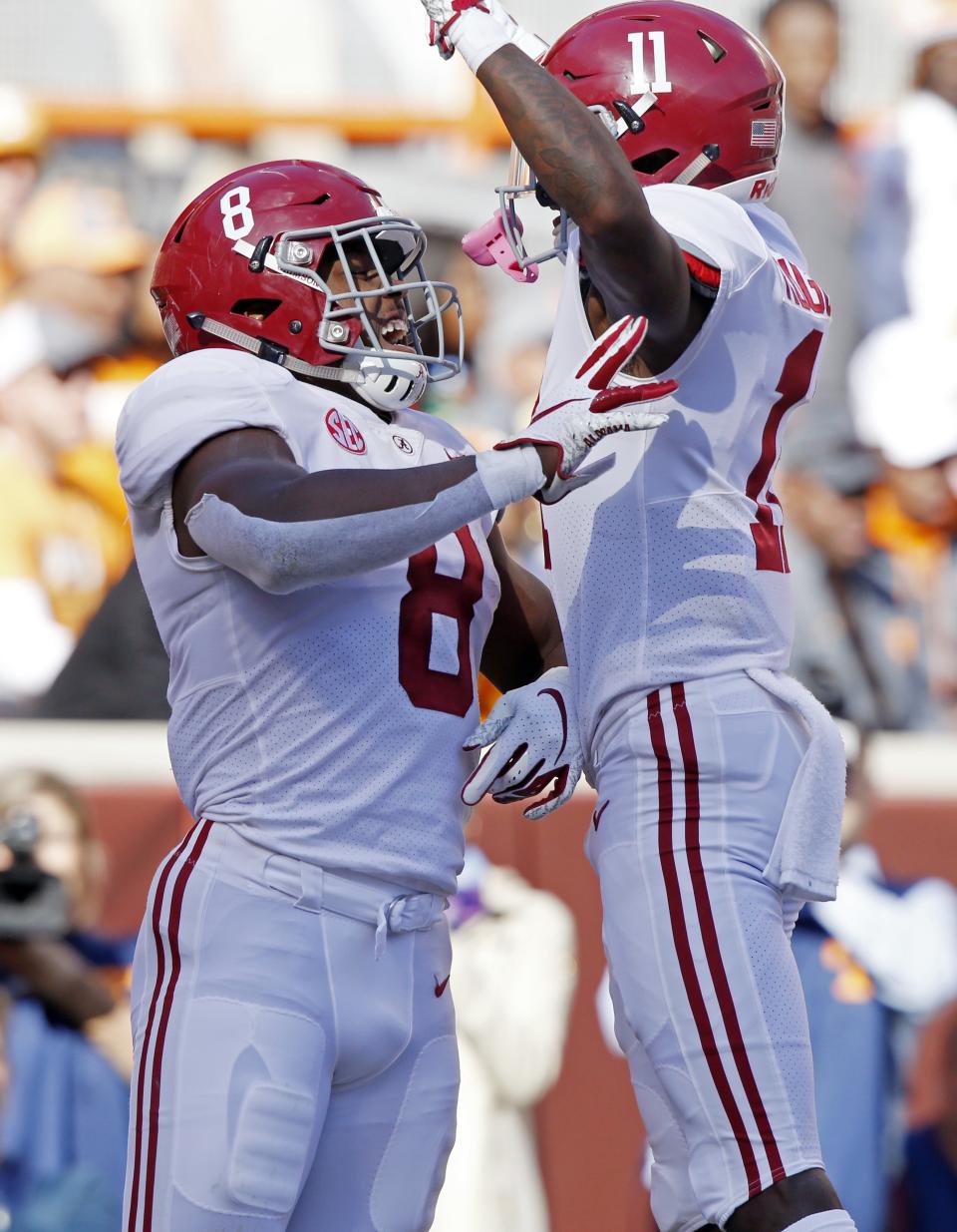 Alabama running back Josh Jacobs (8) celebrates a touchdown with teammate wide receiver Henry Ruggs III (11) in the first half of an NCAA college football game against Tennessee Saturday, Oct. 20, 2018, in Knoxville, Tenn. (AP Photo/Wade Payne)