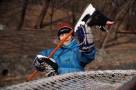 The Wider Image: On a frozen pond far from the Olympics, meet China's ice hockey veterans