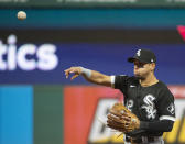 Chicago White Sox's Cesar Hernandez throws Cleveland Indians' Amed Rosario out at first base during the third inning of a baseball game in Cleveland, Saturday, Sept. 25, 2021. (AP Photo/Phil Long)