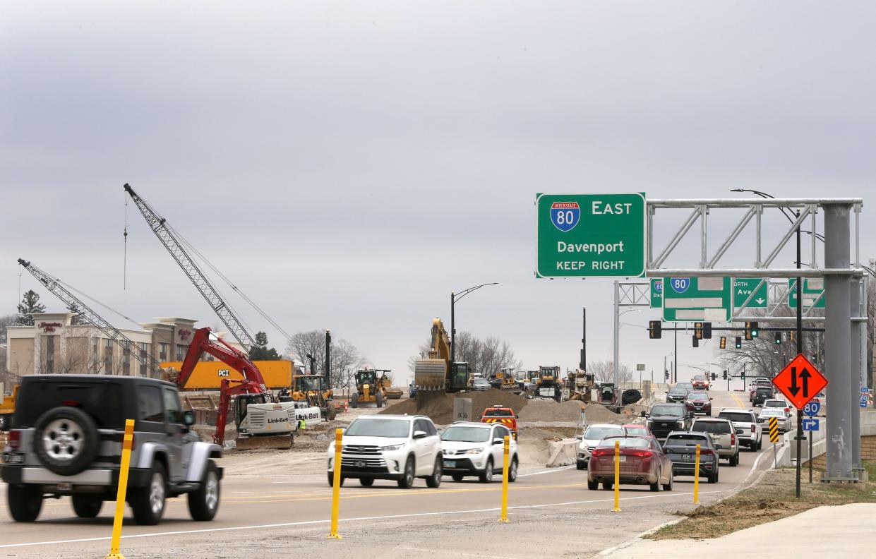 Cars travel along First Avenue as Construction progresses on the First Avenue bridge over Interstate I-80 Monday, March 25, 2024 in Coralville, Iowa.