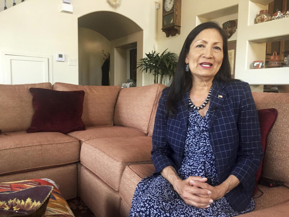 FILE - In this June 6, 2018, file photo, Deb Haaland, a Democratic candidate for Congress for central New Mexico's open seat and a tribal member of the Laguna Pueblo, sits at her Albuquerque home. Haaland who won in New Mexico's 1st congressional district and Native American Democrat Sharice Davids will join U.S. Reps. Tom Cole, who is Chickasaw, and Markwayne Mullin, an enrolled citizen of the Cherokee Nation, in the House. (AP Photo/Russell Contreras, File)