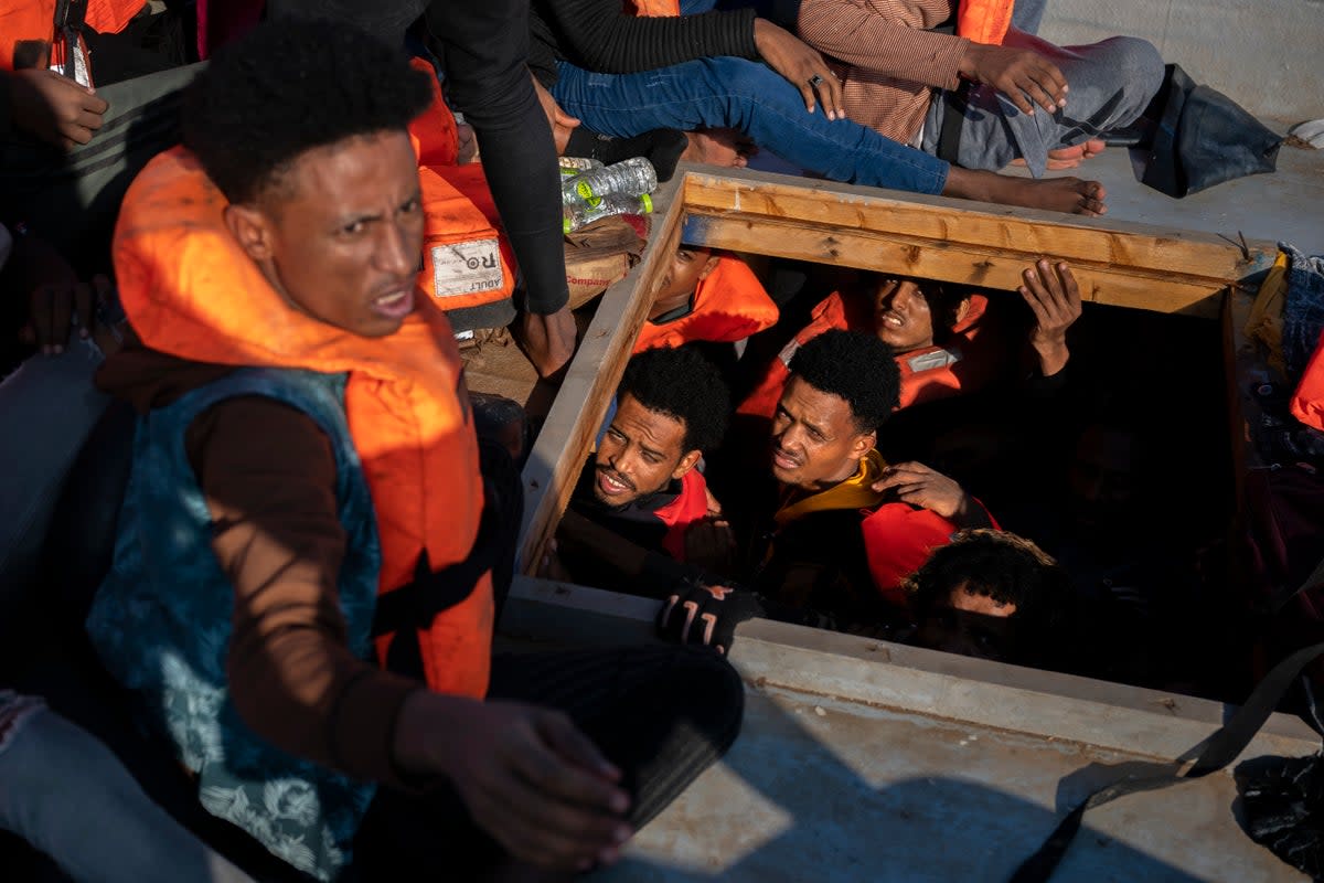 File image: Migrants from Eritrea, Libya and Sudan are crowded in the hold of a wooden boat before being assisted by aid workers (Associated Press)
