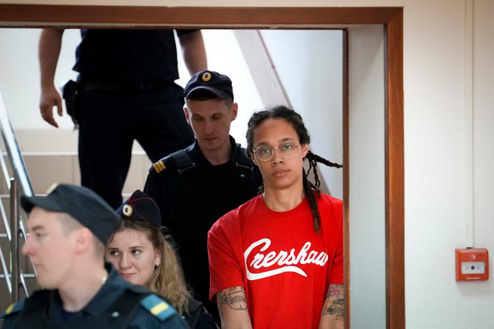 WNBA star and two-time Olympic gold medalist Brittney Griner is escorted to a courtroom for a hearing, in Khimki outside Moscow, Russia, Thursday, July 7, 2022. Griner on Thursday pleaded guilty to drug possession and smuggling during her trial in Moscow but said she had no intention of committing a crime, Russian news agencies reported.