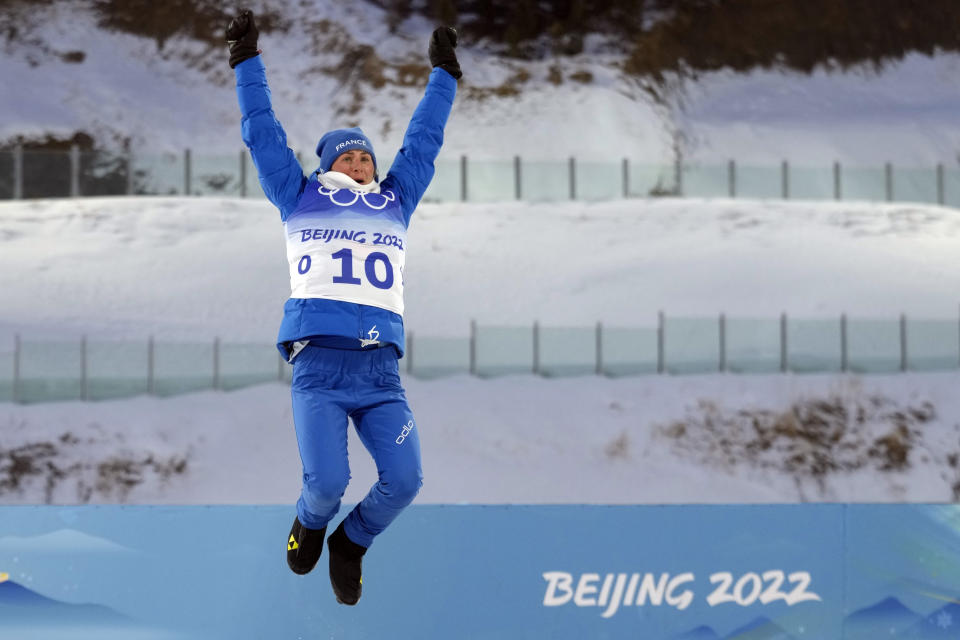 Justine Braisaz-Bouchet of France reacts during the venue ceremony of the women's 12.5-kilometer mass start biathlon at the 2022 Winter Olympics, Friday, Feb. 18, 2022, in Zhangjiakou, China. (AP Photo/Kirsty Wigglesworth)