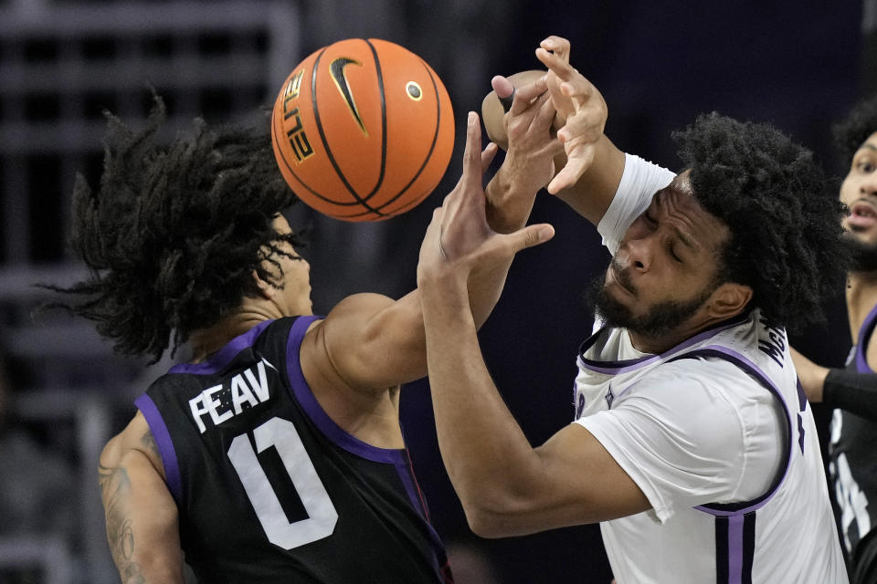 Kansas State forward Will McNair Jr., right, and TCU guard Micah Peavy (0) chase a loose ball during the first half of an NCAA college basketball game Saturday, Feb. 17, 2024, in Manhattan, Kan. (AP Photo/Charlie Riedel)